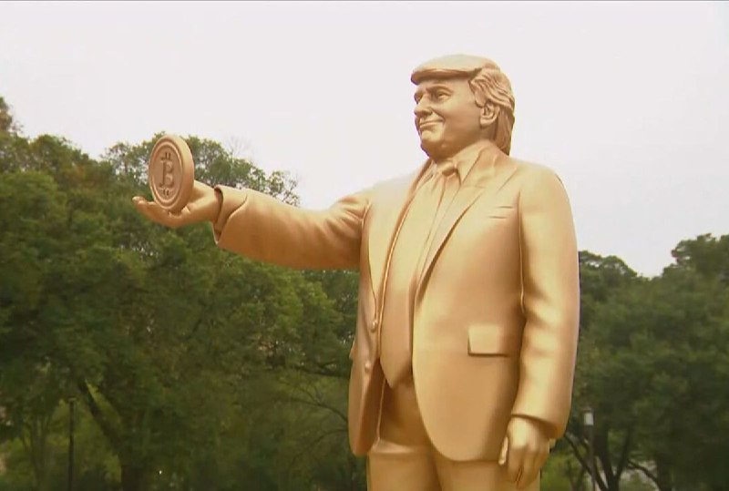 JUST IN: 🇺🇸 Golden statue of President Trump holding a Bitcoin placed outside the US Capitol.@WatcherGuru